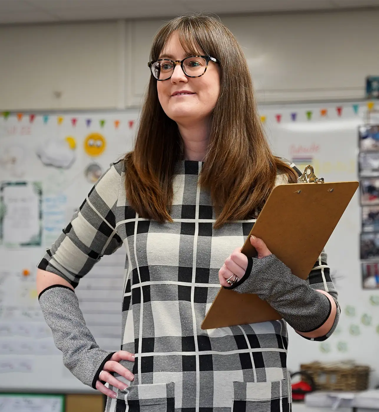 Special Education teacher wearing bitepro arm guards in a classroom